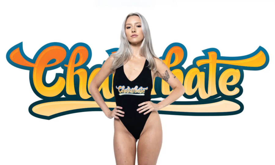 Woman in branded swimsuit standing confidently in front of the Chaturbate logo, representing Chaturbate tokens and pricing in 2025.